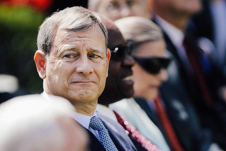 Chief Justice John Roberts sitting down